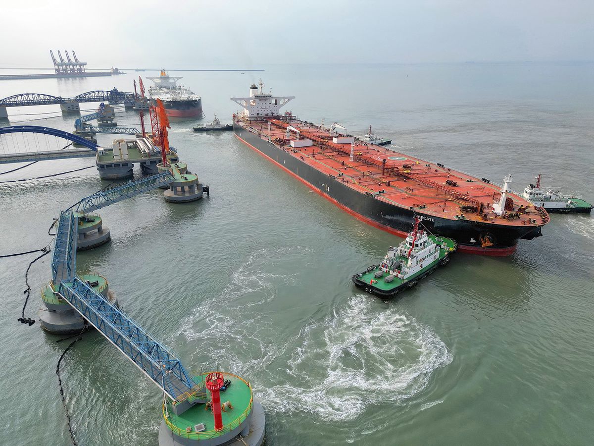 A very large oil tanker loaded with 303,500 tons of diluted bitumen is docked at Yantai Port in Yantai, Shandong Province, China, Aug. 4, 2023. A new record was set for the importation and unloading of diluted bitumen by a single ship at a domestic port. Data from the Ministry of Transport show that in the first half of 2023, China's port cargo throughput reached 8.19 billion tons, an increase of 8 percent year-on-year. Among them, domestic and foreign trade throughput increased by 7.6% and 8.9%, respectively. (Photo by Costfoto/NurPhoto) (Photo by CFOTO / NurPhoto / NurPhoto via AFP)