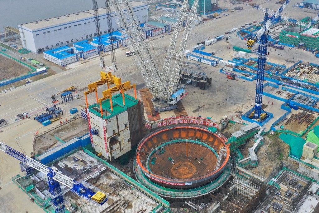 Haiyang Nuclear Power Plant Construction In YantaiA large crane is lifting the CA20 module into the nuclear island of Unit 4 at the Shandong Haiyang Nuclear Power Plant in Yantai, Shandong province, China, on July 14, 2023. The Haiyang Nuclear Power Unit 4 is adopting independently designed and domestically produced CAP1000 technology, with a single unit rated capacity of 1.253 million kilowatts, and is scheduled to be completed and put into operation in 2027. (Photo by Costfoto/NurPhoto) (Photo by CFOTO / NurPhoto / NurPhoto via AFP)