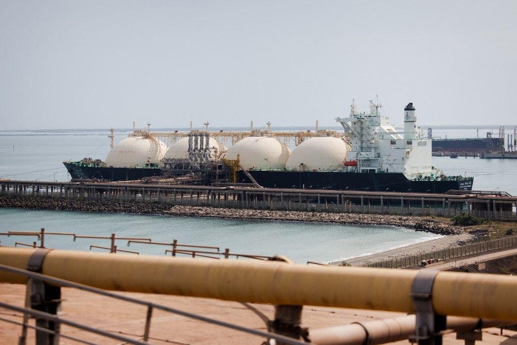 This picture shows the tanker boat "Lalla Fatma N'Soumer" being unloded and delivering LNG (Liquefied Natural Gas) to the uploading dock of Cavaou terminal in Fos-sur-Mer, on June 22, 2023. Cavaou methane terminal, owned by Engie and operated by Elengy, subsidiary company of GRDF, has experienced record activity since the war in Ukraine started. Liquefied Natural Gas mainly comes from Algeria and Qatar, before being regasified there and injected into the network. 25% of the gaz consumed in France arrives here by tanker boats. (Photo by CLEMENT MAHOUDEAU / AFP)