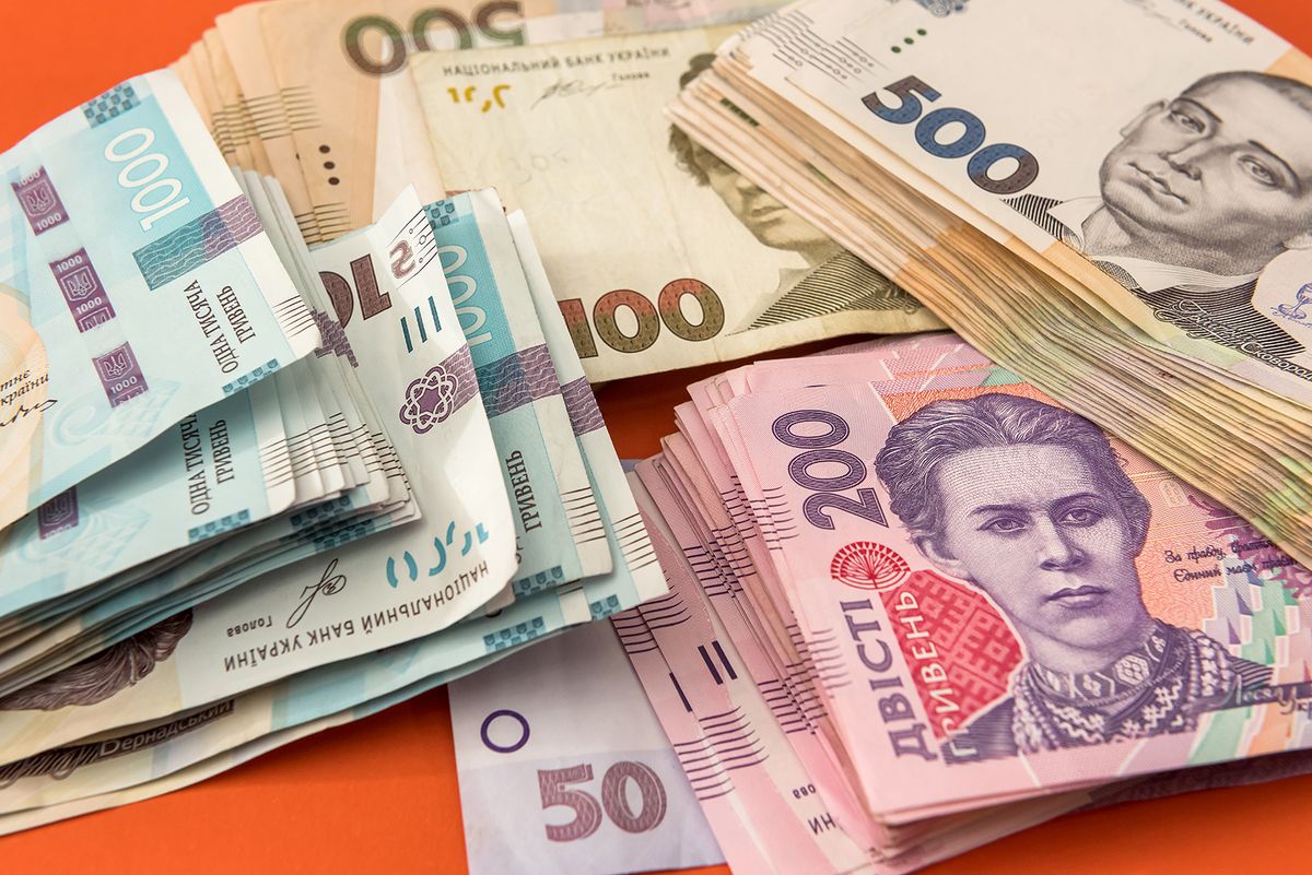 Bundle,Of,Ukrainian,Money,Isolated,On,Red,,Stack,Of,Hryvnia
bundle of Ukrainian money isolated on red, stack of hryvnia uah, 200 500 and new 1000 banknote. money concept
