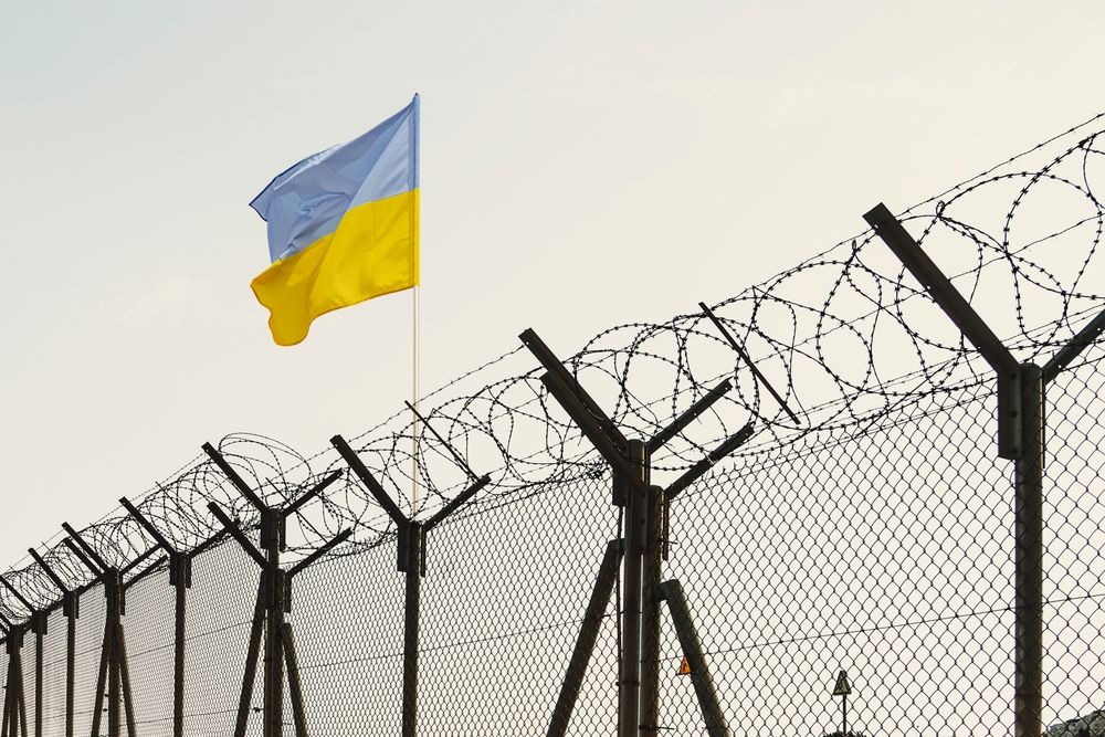 Concept,Of,Ukraine,Closed,Borders,With,Flag,And,Wire,Fence.