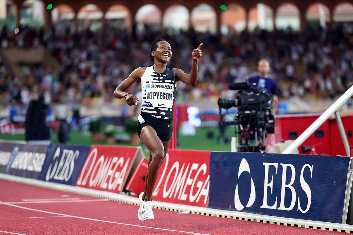 Faith Kipyegon of Kenya celebrates after breaking the World Record and winning in the Women's One Mile event during the IAAF Diamond League "Herculis" athletics meeting at the Louis II Stadium in Monaco, on July 21, 2023. (Photo by CLEMENT MAHOUDEAU / AFP)