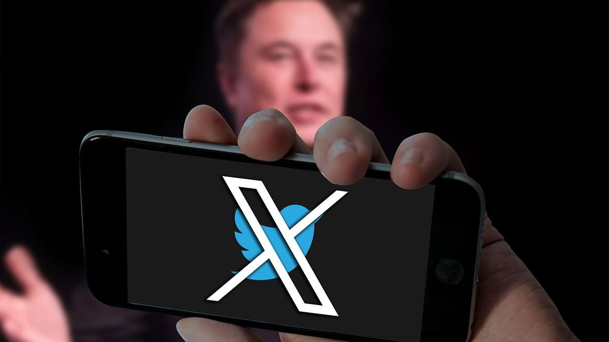 CHENNAI, INDIA, 24TH JULY 2023: Twitter X with bird logo in holding mobile and Elon musk picture in blurred laptop screen background.