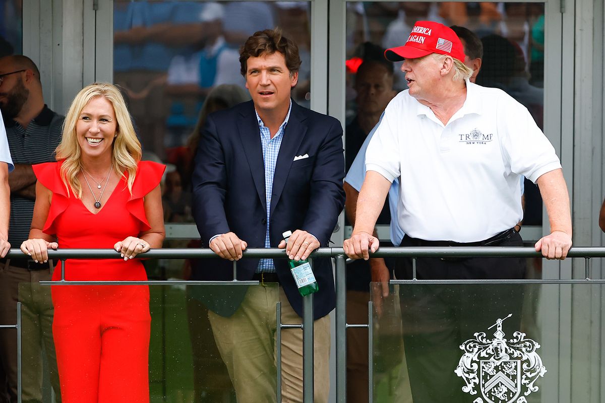 BEDMINSTER, NJ - JULY 31:  Former President Donald Trump, Tucker Carlson and Marjorie Taylor Greene during the 3rd round of the LIV Golf Invitational Series Bedminster on July 31, 2022 at Trump National Golf Club in Bedminster, New Jersey. (Credit Image: © Rich Graessle/Icon SMI via ZUMA Press)