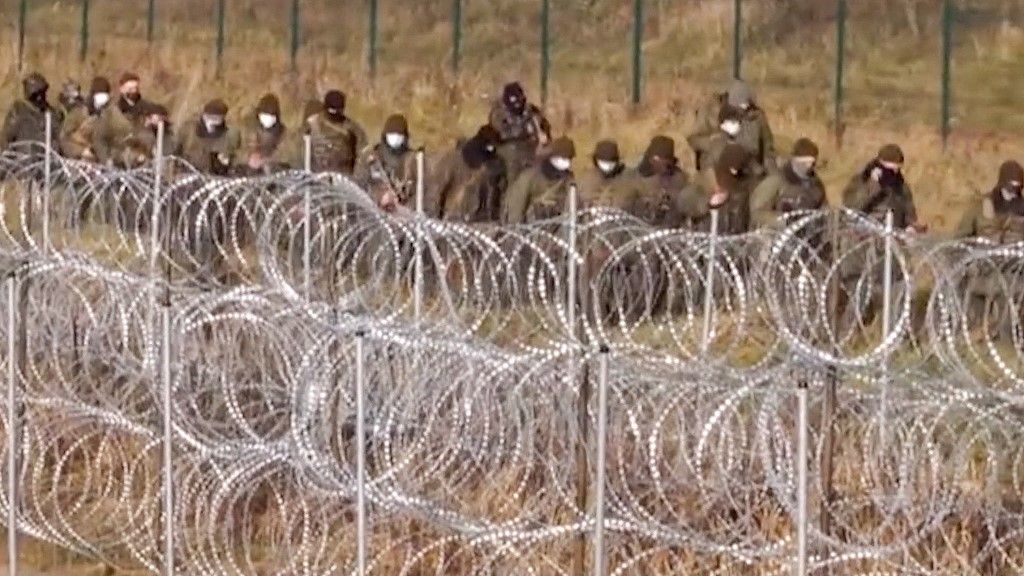 The video grab made from footage released by the Polish Defence Ministry on November 13, 2021 and said to show Belarusian forces deploying near the Kuznica border crossing. The Polish border guards accused Belarusian forces of destroying some barbed wire fencing laid down by Polish forces overnight, releasing a video that purported to show Belarusian forces using lasers and strobe lighting while doing so. (Photo by Handout / Polish Defence Ministry / AFP) / RESTRICTED TO EDITORIAL USE - MANDATORY CREDIT "AFP PHOTO / POLISH DEFENCE MINISTRY" - NO MARKETING - NO ADVERTISING CAMPAIGNS - DISTRIBUTED AS A SERVICE TO CLIENTS