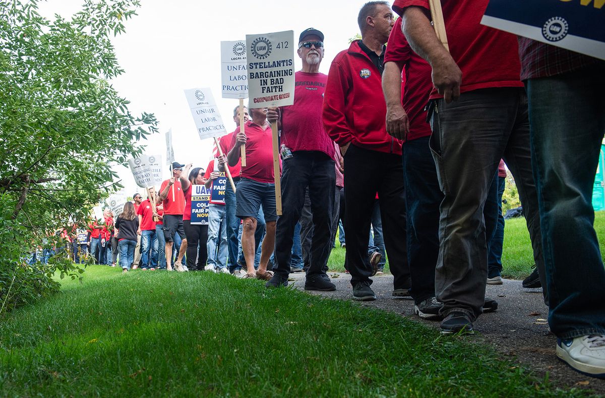 Members of the United Auto Workers (UAW) union hold a practice picket in front of Stellantis headquarters in Auburn Hills, Michigan, on September 20, 2023. The picket comes as Chrysler’s parent company, Stellantis, is reportedly planning to sell the center as part of a union deal. (Photo by Matthew Hatcher / AFP)