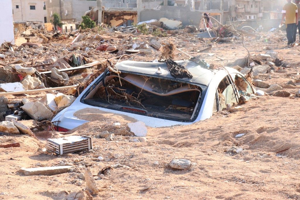 Death toll in Libya floods rises to 5,300DERNA, LIBYA - SEPTEMBER 12: A damaged vehicle is stuck debris after the floods caused by the Storm Daniel ravaged disaster zones in Derna, Libya on September 12, 2023. The death toll from devastating floods in Libya’s eastern city of Derna has risen to 5,300 and thousands of people are still missing, the country’s official news agency reported on Tuesday. Abdullah Mohammed Bonja / Anadolu Agency (Photo by Abdullah Mohammed Bonja / ANADOLU AGENCY / Anadolu Agency via AFP)