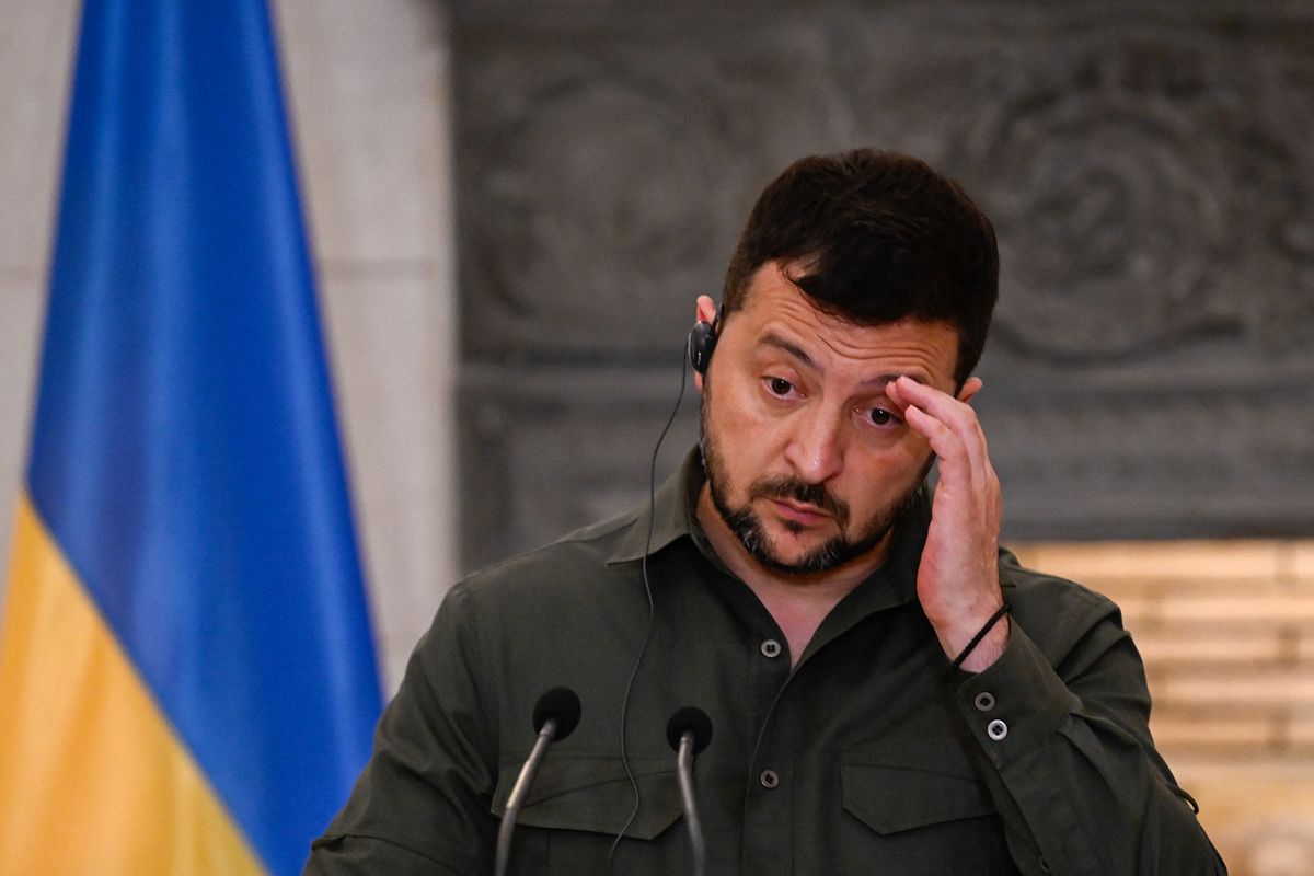 Ukraine's President Volodymyr Zelensky reacts during a joint press conference with Greece's Prime Minister Kyriakos Mitsotakis (not pictured) after their meeting in Athens on August 21, 2023. Ukrainian President Volodymyr Zelensky has landed in Athens for an official visit, the Greek prime minister's office said, and would later join an informal dinner with EU and Balkans leaders.Greece has been a strong supporter of Ukraine since Russia's invasion, providing humanitarian aid and weapons including infantry fighting vehicles, Kalashnikov assault rifles, launchers and ammunition. (Photo by Aris MESSINIS / AFP)