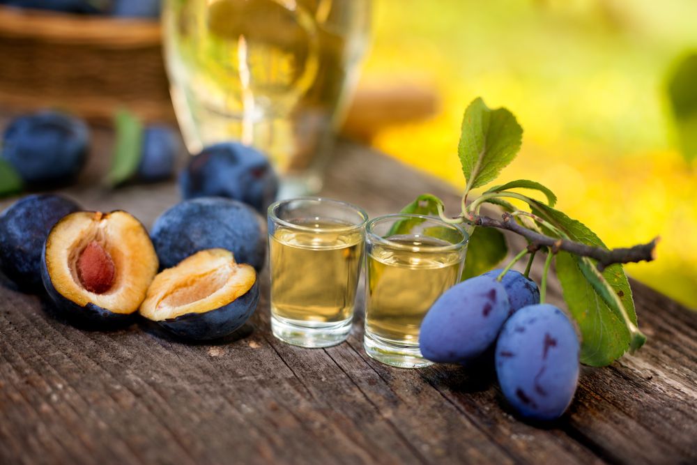 Plums,And,Shot,Glasses,With,Rakia,On,The,Table