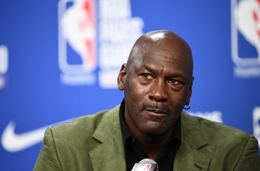Former NBA star and owner of Charlotte Hornets team Michael Jordan looks on as he addresses a press conference ahead of the NBA basketball match between Milwaukee Bucks and Charlotte Hornets at The AccorHotels Arena in Paris on January 24, 2020. (Photo by FRANCK FIFE / AFP)