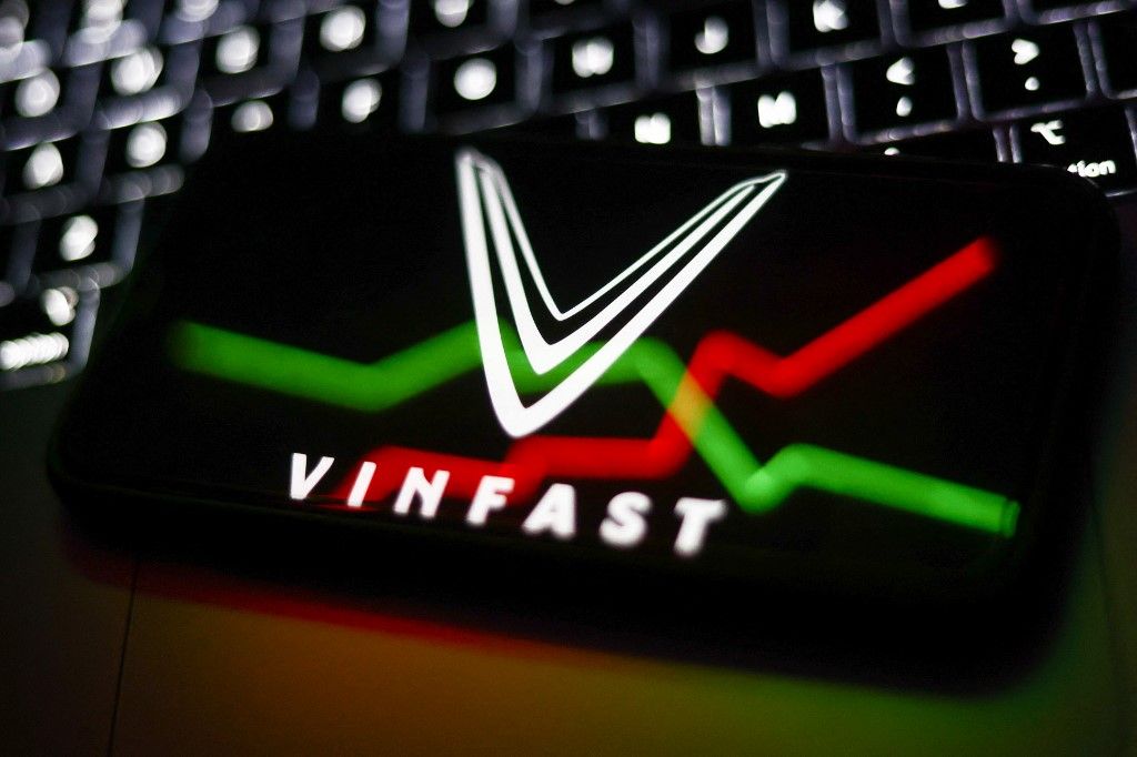 VinFast Photo IllustrationsA laptop keyboard and VinFast logo displayed on a phone screen with an illustrative stock graph reflected on a screen are seen in this illustration photo taken in Krakow, Poland on August 16, 2023. (Photo by Jakub Porzycki/NurPhoto) (Photo by Jakub Porzycki / NurPhoto / NurPhoto via AFP)