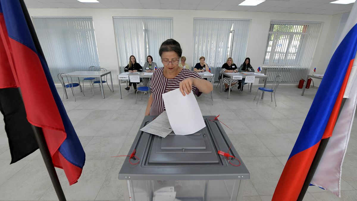 A woman votes at a polling station during local elections organised by the Russian-installed authorities in Donetsk, Russian-controlled Ukraine, on September 8, 2023. (Photo by AFP)