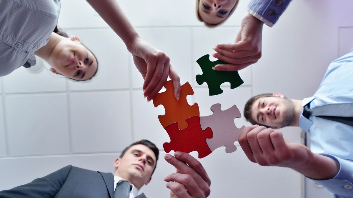 Group,Of,Business,People,Assembling,Jigsaw,Puzzle,And,Represent,Team
Group of business people assembling jigsaw puzzle and represent team support and help concept