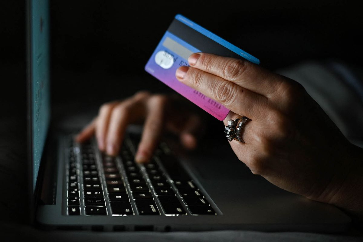 Daily Life In Edmonton During The Covid-19 Pandemic
An illustrative image of a person holding a credit card while shopping on-line on a computer, in an apartment during the coronavirus pandemic.On Tuesday, January 11, 2021, in Edmonton, Alberta, Canada. (Photo by Artur Widak/NurPhoto) (Photo by Artur Widak / NurPhoto / NurPhoto via AFP)