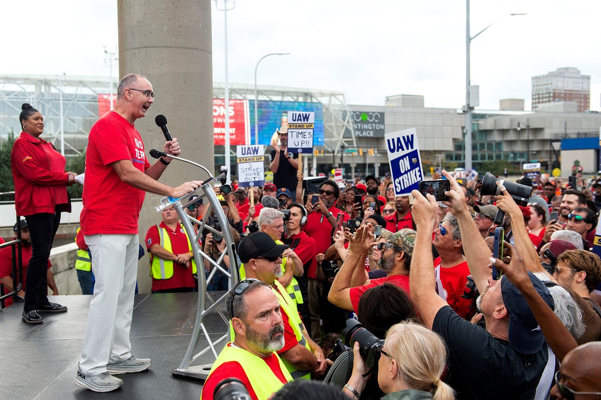(FILES) United Auto Workers (UAW) union president Shawn Fain speaks to members of the United Auto Workers (UAW) union during a rally in Detroit, Michigan, on September 15, 2023. The United Auto Workers chief warned on September 17, 2023 that a historic strike at the nation's top three car manufacturers will expand if the companies do not raise their wage offers in ongoing negotiations. (Photo by Matthew Hatcher / AFP)