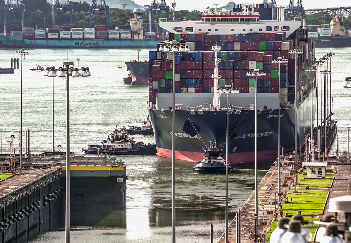 A cargo ship navigates through the Panama Canal in the area of the Cocoli Locks, in Panama City on Agust 25, 2023. The drought-hit Panama Canal will maintain restrictions on the passage of ships for one year, a measure that has already led to a marine traffic jam as boats line up to enter the crucial waterway linking two oceans, an official said late Thursday. (Photo by Ivan PISARENKO / AFP)