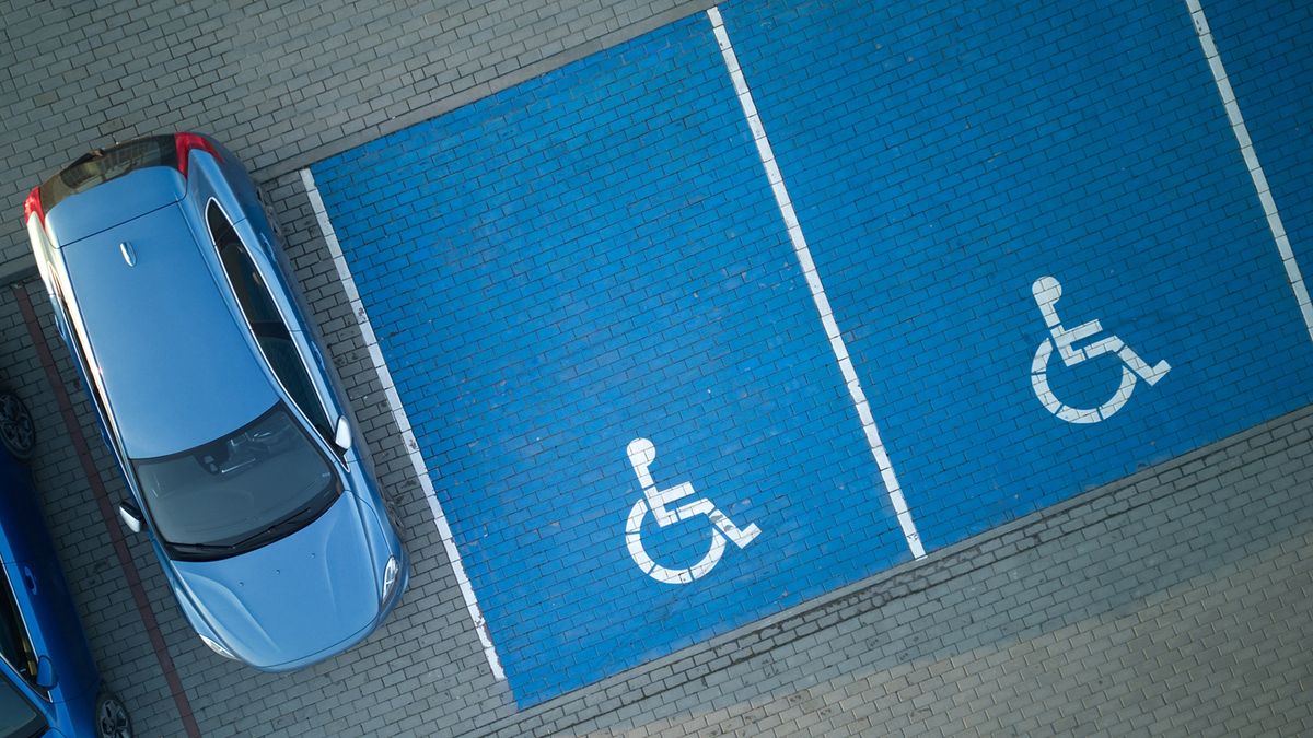 Outdoor,Car,Parking,With,Handicapped,Symbol,Icon.,Parking,Places,Reserved
Outdoor car parking with handicapped symbol icon. Parking places reserved for disabled person. Aerial drone view.