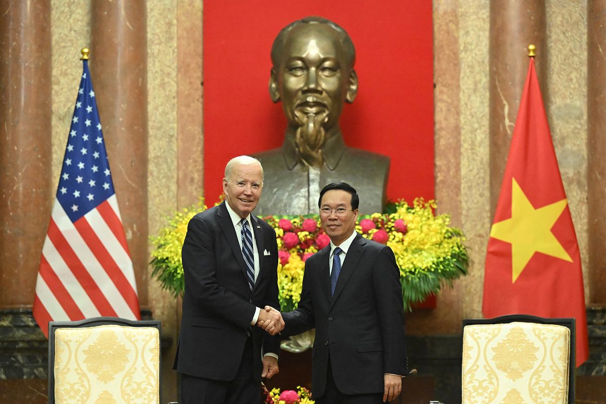 Vietnam's President Vo Van Thuong and US President Joe Biden shake hands during a meeting at the Presidential Palace in Hanoi on September 11, 2023. The United States and Vietnam warned against the "threat or use of force" in the disputed South China Sea, days after the latest clash involving Chinese vessels. (Photo by SAUL LOEB / AFP)