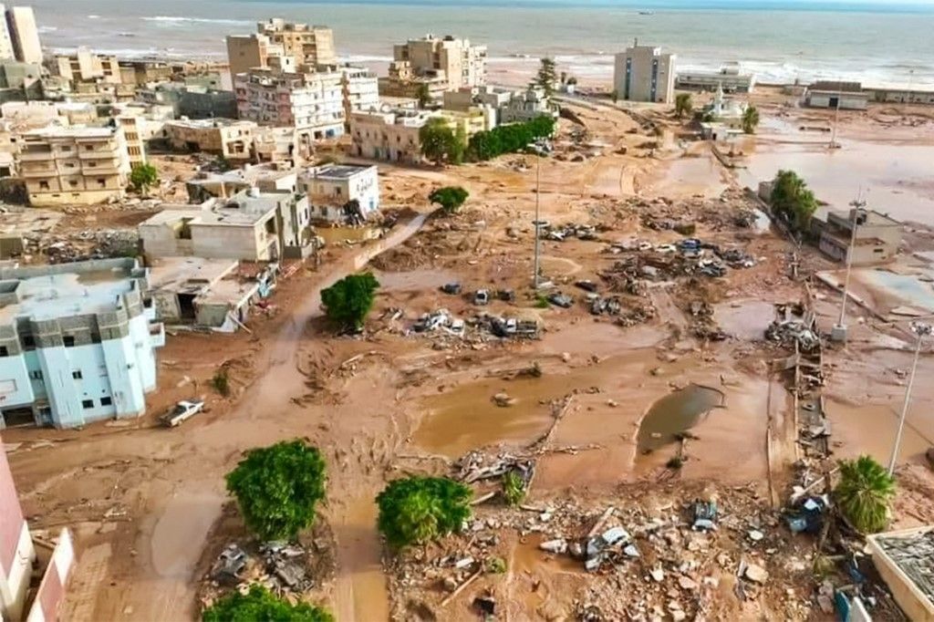 This handout picture released on the account of the Libyan Red Crescent on the X (formerly Twitter) platform on September 13, 2023, shows a general view of destruction in the wake of floods after the Mediterranean storm "Daniel" hit Libya's eastern city of Derna. A global effort to assist stricken Libya gathered pace on September 14 after a tsunami-like flood killed nearly 4,000 people and left thousands missing. Military transport aircraft from Middle Eastern and European nations, along with ships, have been ferrying emergency aid to the North African country already scarred by war. (Photo by Libyan Red Crescent / AFP) / RESTRICTED TO EDITORIAL USE - MANDATORY CREDIT "AFP PHOTO / HO / LIBYAN RED CRESCENT" - NO MARKETING NO ADVERTISING CAMPAIGNS - DISTRIBUTED AS A SERVICE TO CLIENTS