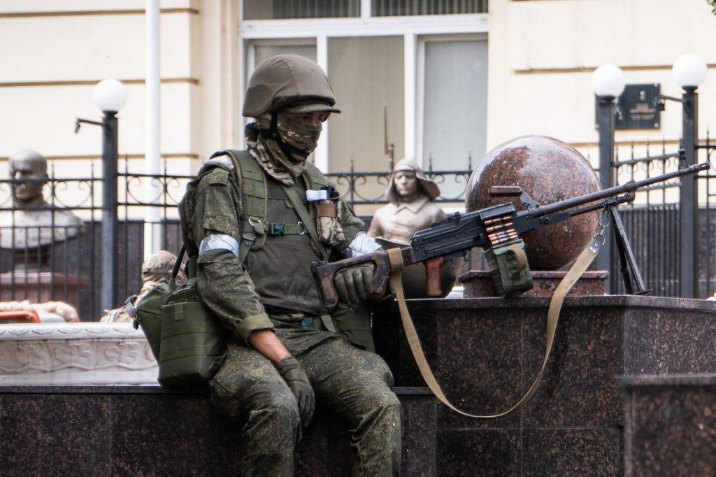 A member of Wagner group stands guard in Rostov-on-Don, on June 24, 2023. President Vladimir Putin on June 24, 2023 said an armed mutiny by Wagner mercenaries was a "stab in the back" and that the group's chief Yevgeny Prigozhin had betrayed Russia, as he vowed to punish the dissidents. Prigozhin said his fighters control key military sites in the southern city of Rostov-on-Don. (Photo by Roman ROMOKHOV / AFP) / “The erroneous mention[s] appearing in the byline of this photo has been modified in AFP systems in the following manner: [Roman Romokhov] instead of [Denis Romanov]. Please immediately remove the erroneous mention[s] from all your online services and delete it (them) from your servers. If you have been authorized by AFP to distribute it (them) to third parties, please ensure that the same actions are carried out by them. Failure to promptly comply with these instructions will entail liability on your part for any continued or post notification usage. Therefore we thank you very much for all your attention and prompt action. We are sorry for the inconvenience this notification may cause and remain at your disposal for any further information you may require.”