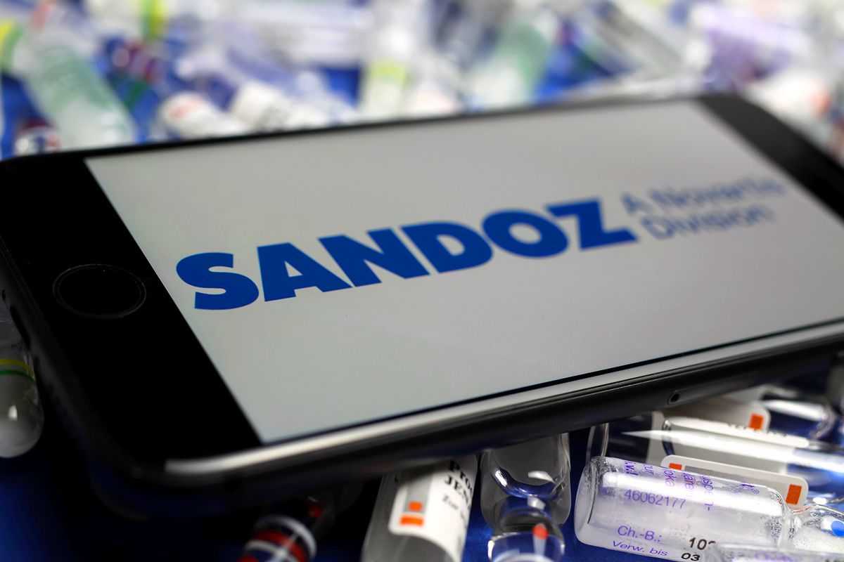 Viersen,,Germany,-,May,9.,2020:,Close,Up,Of,Mobile
Viersen, Germany - May 9. 2020: Close up of mobile phone screen with logo lettering of Sandoz pharmaceutical company on pile drug ampules (selective focus on letter S left)