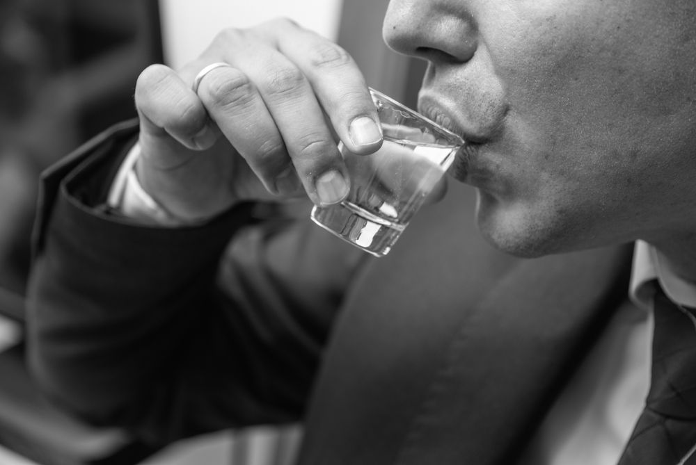 Closeup,Of,Male,Hand,And,Lips,While,Drinking,Glass,Of