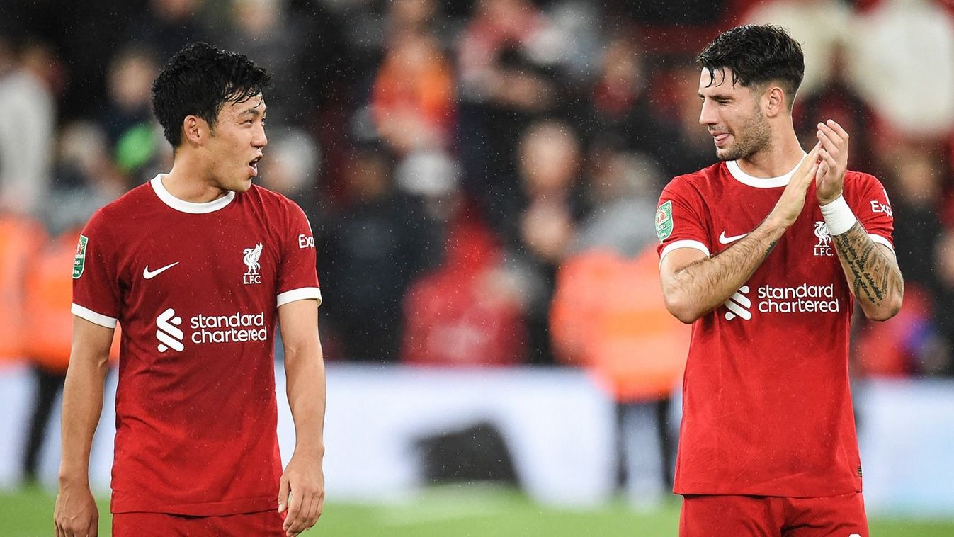 Liverpool's Japanese midfielder #03 Wataru Endo (L) and Liverpool's Hungarian midfielder #08 Dominik Szoboszlai react at the end of the English League Cup third round football match between Liverpool and Leicester City at Anfield in Liverpool, north west England on September 27, 2023. Liverpool wins 3 - 1 against Leicester City. (Photo by PETER POWELL / AFP) / RESTRICTED TO EDITORIAL USE. No use with unauthorized audio, video, data, fixture lists, club/league logos or 'live' services. Online in-match use limited to 120 images. An additional 40 images may be used in extra time. No video emulation. Social media in-match use limited to 120 images. An additional 40 images may be used in extra time. No use in betting publications, games or single club/league/player publications. /