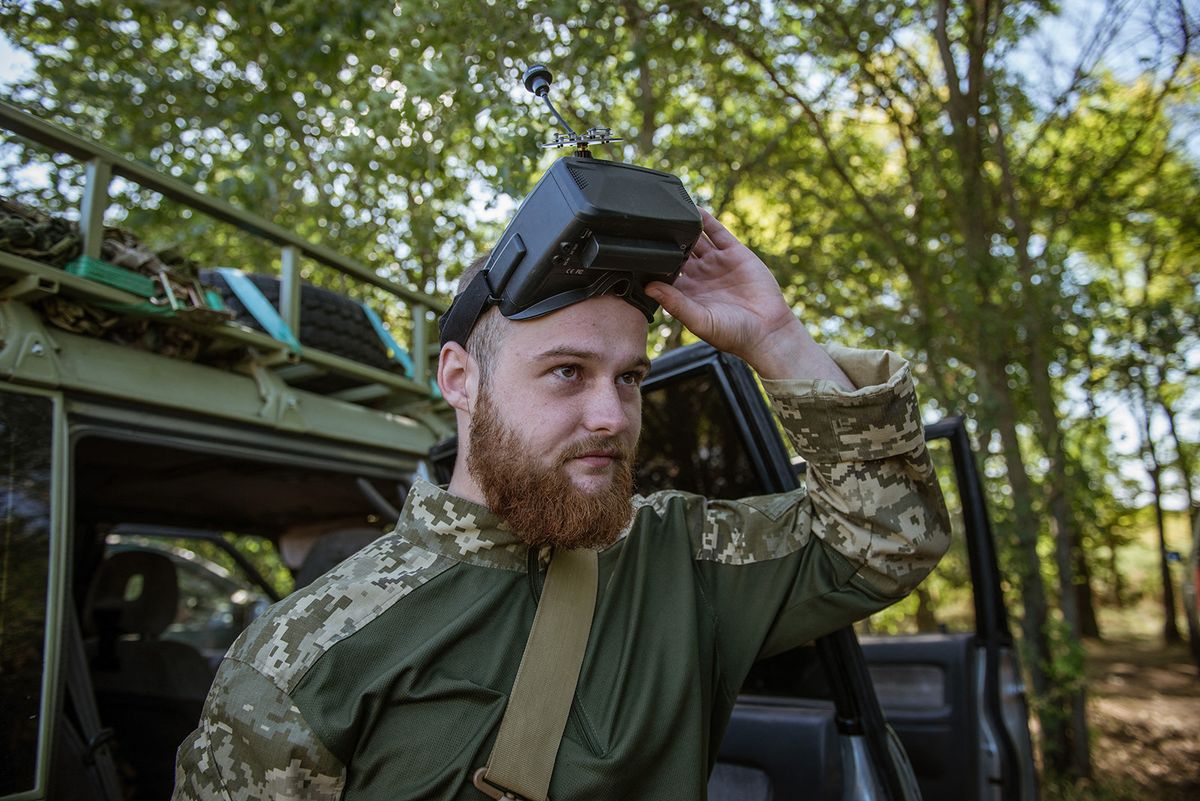 ZAPORIZHZHIA OBLAST, UKRAINE - AUGUST 23: 22 year-old Ukrainian soldier, Bohdan from the Territorial Defense Unit (TRO) at the 62nd Battalion of the 103rd Brigade, operates a FPV drone using googles during a military training near the Huliapole district of Zaporizhzhia in Ukraine on August 23, 2023. Ukrainian infantry and drone units, which perform both attack and surveillance purposes, continue their exercises at the Huliapole district of Zaporizhzhia. Huliaipole in Southern Ukraine, is about 5 km from the Russian positions, has been a front-line city for more than a year. As the attack on the Southern Front developed and advanced in the city, the attacks with artillery and planes has increased. Andre Alves / Anadolu Agency (Photo by Andre Alves / ANADOLU AGENCY / Anadolu Agency via AFP)