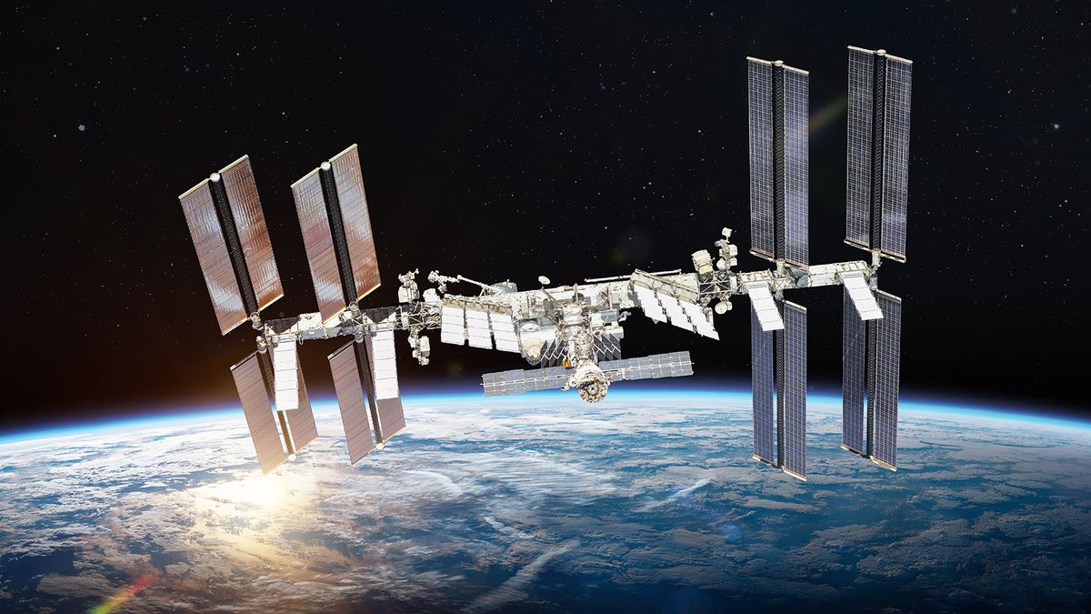 International,Space,Station,On,Orbit,Of,Earth,Planet.,Iss.,DarkInternational space station on orbit of Earth planet. ISS. Dark background. Sun reflection. Elements of this image furnished by NASA