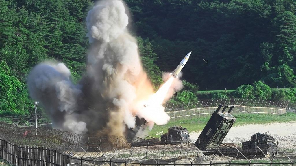EDITORS NOTE: Graphic content / This handout photo taken on July 5, 2017 and provided by South Korean Defence Ministry in Seoul shows US M270 Multiple Launch Rocket System firing an MGM-140 Army Tactical Missile into the East Sea from an undisclosed location on South Korea's east coast during a South Korea-US joint missile drill aimed to counter North Korea’s ICBM test. South Korea and the United States fired off missiles on July 5 simulating a precision strike against North Korea's leadership, in response to a landmark ICBM test described by Kim Jong-Un as a gift to "American bastards". (Photo by Handout / South Korean Defence Ministry / AFP) / RESTRICTED TO EDITORIAL USE - MANDATORY CREDIT "AFP PHOTO /South Korean Defence Ministry" - NO MARKETING NO ADVERTISING CAMPAIGNS - DISTRIBUTED AS A SERVICE TO CLIENTS