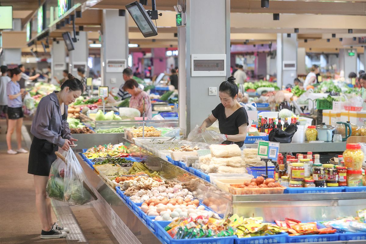 Daily Life in Huzhou
HUZHOU, CHINA - AUGUST 24, 2023 - People shop for vegetables at Xingkang Comprehensive Market in Wukang Street, Deqing County, Huzhou city, East China's Zhejiang province, Aug. 24, 2023. (Photo by Costfoto/NurPhoto) (Photo by CFOTO / NurPhoto / NurPhoto via AFP)