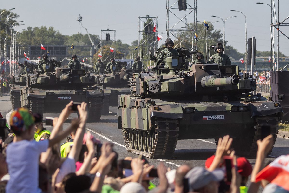 Polish soldiers on Korean-made K2 tanks take part in a military parade in Warsaw on Polish Army Day, August 15, 2023, to commemorate the anniversary of the 1920 victory over Soviet Russia at the Battle of Warsaw during the Polish–Soviet War. (Photo by Wojtek RADWANSKI / AFP)