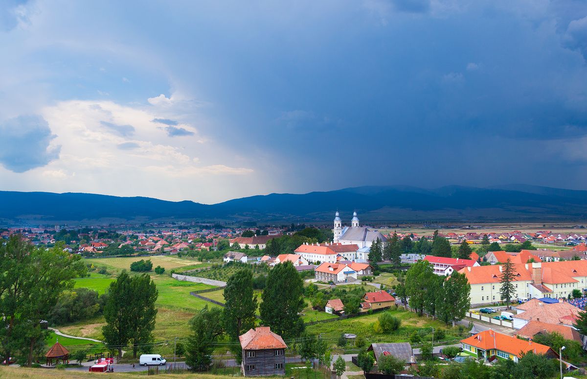 View,Of,An,Approaching,Storm,Over,Csiksomlyo,,Transylvania.,Blue,Clouds,
View of an approaching storm over Csiksomlyo, Transylvania. Blue clouds, hills in the background.