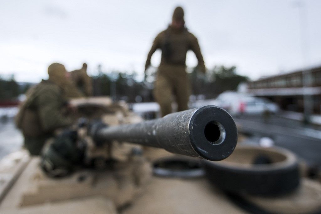 (FILES) US Marines prepare their M1 Abrams tank to take part in an exercise to capture an airfield as part of the Trident Juncture 2018, a NATO-led military exercise, on November 1, 2018 near the town of Oppdal, Norway. The United States will provide depleted uranium tank ammunition to Ukraine as part of a $175 million aid package, the Pentagon said on September 6, 2023. The 120mm rounds are for the US M1 Abrams tanks that Washington has promised to Kyiv and which are expected to be delivered before the end of the year. (Photo by Jonathan NACKSTRAND / AFP)
