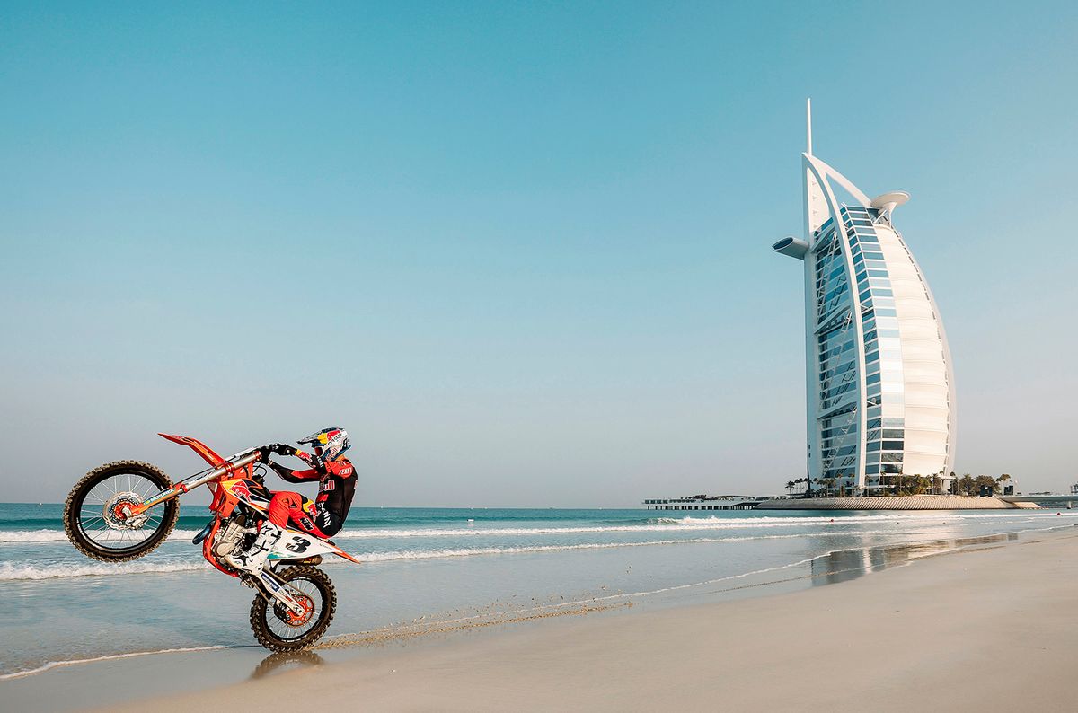 Sam Sunderland is making another bid for his second Dakar Rally title in Saudi Arabia with the British biker preparing for his quest by returning to his Dubai training grounds to race through iconic landmarks and stand on top of the highest building in the world. The Gas Gas Factory Racing rider raced past a litany of iconic landmarks to the top of the world's tallest building – Burj Khalifa – on his motorbike, joining an exclusive list of people - which includes movie stars Tom Cruise and Will Smith - to reach the dizzying heights of the 828m tall skyscraper. The athlete encountered multiple terrains and scenarios synonymous with the fabric of Dubai culture on his way there, to tackle areas where a motorbike had never been ridden before. // Sam Sunderland seen during the production of the Yalla project at Burj Al Arab in Dubai, United Arab Emirates on October 23, 2021 // Naim Chidiac / Red Bull Content Pool
