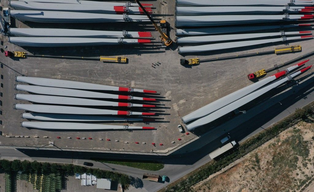 Turkish Aegean city Izmir becomes IZMIR, TURKIYE - APRIL 13: An aerial view of wind turbine blades at the base for wind turbine blade production in Izmir, Turkiye on April 13, 2023. Increasing interest in renewable energy in the world has boosted Turkiye's export power as a base for wind turbine blade production, with Turkiye producing about one-third of the blades in wind turbines installed in Europe last year. Global blade manufacturers, which can deliver the blades they produce to many parts of the world by taking advantage of Izmir's logistical advantages, produce around 4 thousand blades in the city every year. While most of the blades are exported, the rest are used in domestic turbine installations. Lokman Ilhan / Anadolu Agency (Photo by Lokman Ilhan / ANADOLU AGENCY / Anadolu Agency via AFP)production base of wind turbine blades