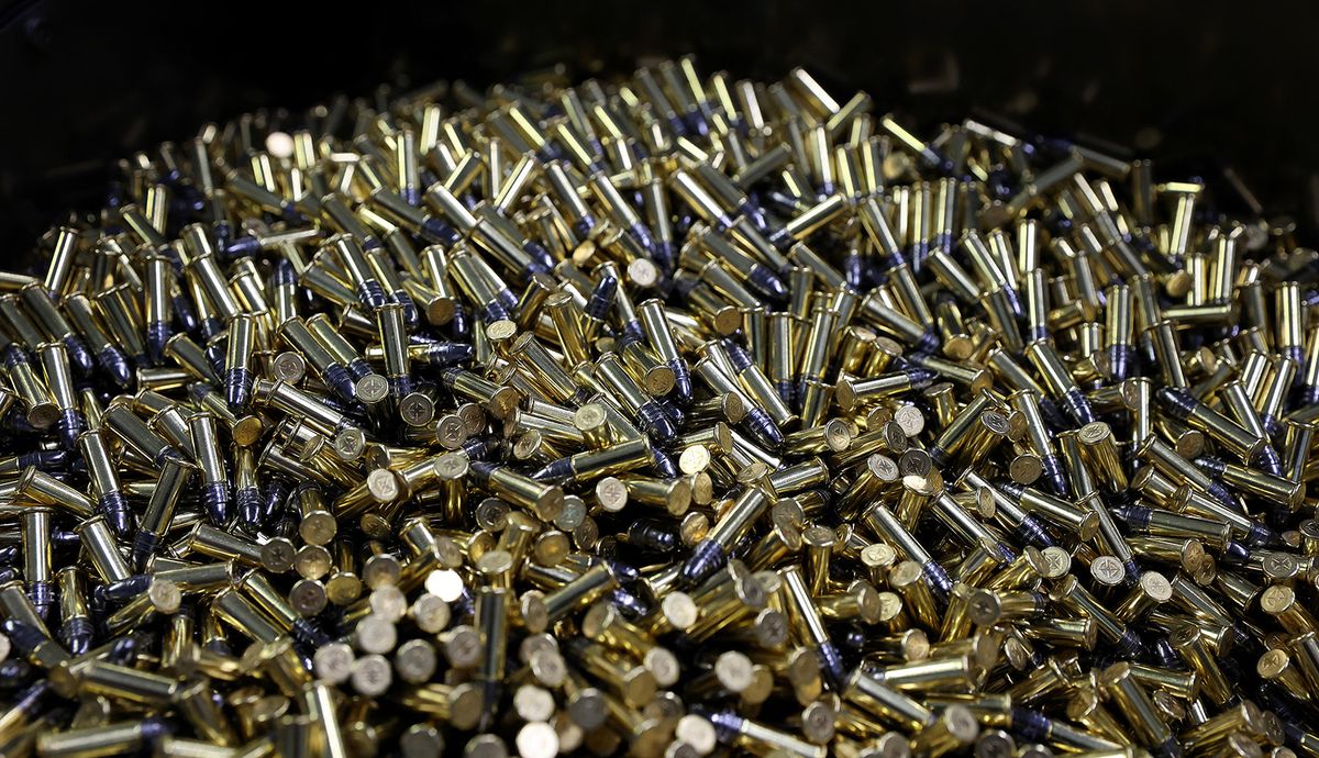 An Ammo box is filled with rimfire cartridges at the Lapua rimfire production factory (Nammo Corporation) on July 12, 2021 in Schoenebeck near Magdeburg, eastern Germany. For the French Biathlon team, the Winter Olympics are being prepared in the heart of summer, in a German munitions factory steeped in history, where a cold room recreates the freezing temperatures of the competitions. (Photo by Ronny Hartmann / AFP)