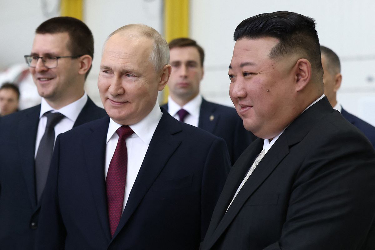 In this pool photog distributed by Sputnik agency, Russia's President Vladimir Putin (L) and North Korea's leader Kim Jong Un (R) visit the Vostochny Cosmodrome in Amur region on September 13, 2023. Russian President Vladimir Putin and North Korean leader Kim Jong Un both arrived at the Vostochny Cosmodrome in Russia's Far East, Russian news agencies reported on September 13, ahead of planned talks that could lead to a weapons deal. (Photo by Vladimir SMIRNOV / POOL / AFP)
