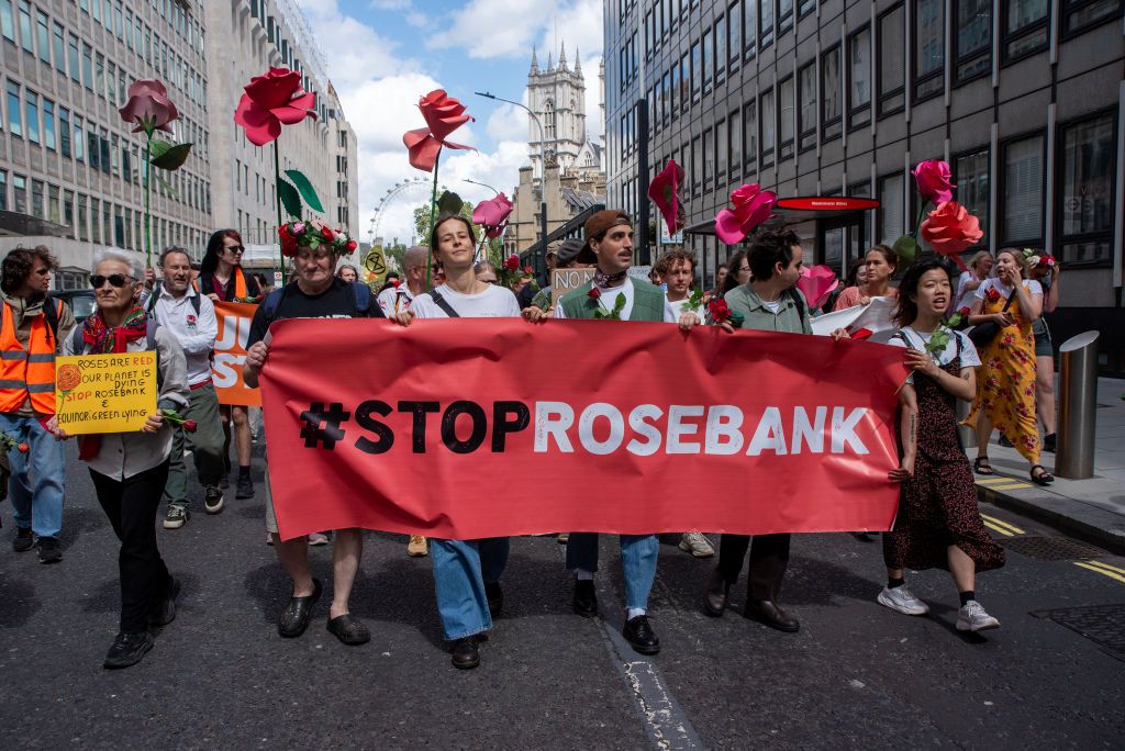 Protesters march with roses, placard and banner expressingLONDON, UNITED KINGDOM - 2023/07/15: Protesters march with roses, placard and banner expressing their opinion during the demonstration. Rosebank is the UK's biggest undeveloped oil and gas field with a total of nearly 500 million barrels of oil. Its operator is Equinor a Norwegian state-owned multinational energy company. Protesters marched from the Westminster Conference to Center to Equinor's offices in central London. Scientists have demonstrated that fossil fuels are driving climate change. (Photo by Krisztian Elek/SOPA Images/LightRocket via Getty Images)LONDON, UNITED KINGDOM - 2023/07/15: Protesters march with roses, placard and banner expressing their opinion during the demonstration. Rosebank is the UK's biggest undeveloped oil and gas field with a total of nearly 500 million barrels of oil. Its operator is Equinor a Norwegian state-owned multinational energy company. Protesters marched from the Westminster Conference to Center to Equinor's offices in central London. Scientists have demonstrated that fossil fuels are driving climate change. (Photo by Krisztian Elek/SOPA Images/LightRocket via Getty Images)