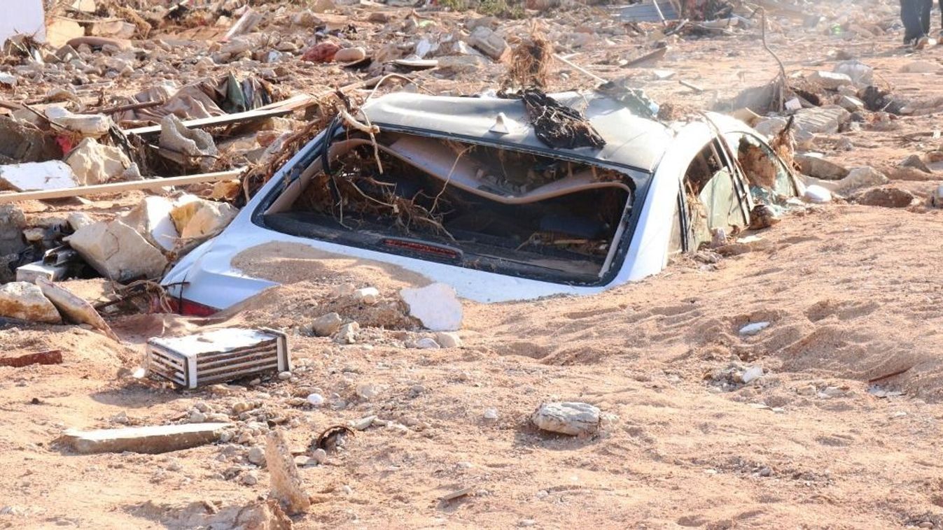 Death toll in Libya floods rises to 5,300DERNA, LIBYA - SEPTEMBER 12: A damaged vehicle is stuck debris after the floods caused by the Storm Daniel ravaged disaster zones in Derna, Libya on September 12, 2023. The death toll from devastating floods in Libya’s eastern city of Derna has risen to 5,300 and thousands of people are still missing, the country’s official news agency reported on Tuesday. Abdullah Mohammed Bonja / Anadolu Agency (Photo by Abdullah Mohammed Bonja / ANADOLU AGENCY / Anadolu Agency via AFP)