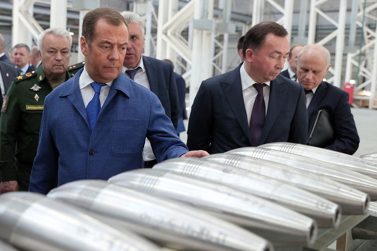 Russia's former leader Dmitry Medvedev, a President Putin ally who is now deputy chairman of the country's security council, visits the Aleksin Experimental Mechanical Plant in the Tula region on June 15, 2023. (Photo by Yekaterina SHTUKINA / SPUTNIK / AFP)