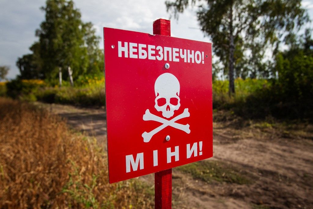 Press tour to Zhytomyr Region on humanitarian deminingZHYTOMYR REGION, UKRAINE - SEPTEMBER 20, 2023 - The 'Danger! Mines!' sign is pictured during a press tour set to demonstrate the integration of AI into the process of humanitarian demining, Zhytomyr Region, northern Ukraine. NO USE RUSSIA. NO USE BELARUS. (Photo by Ukrinform/NurPhoto) (Photo by Kirill Chubotin / NurPhoto / NurPhoto via AFP)