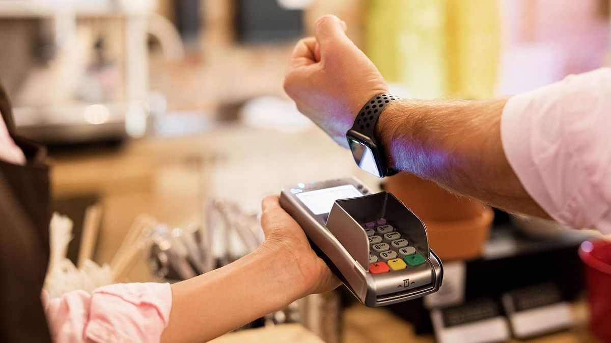 Person,Paying,At,Cafe,With,Smart,Watch,Wirelessly,On,Pos