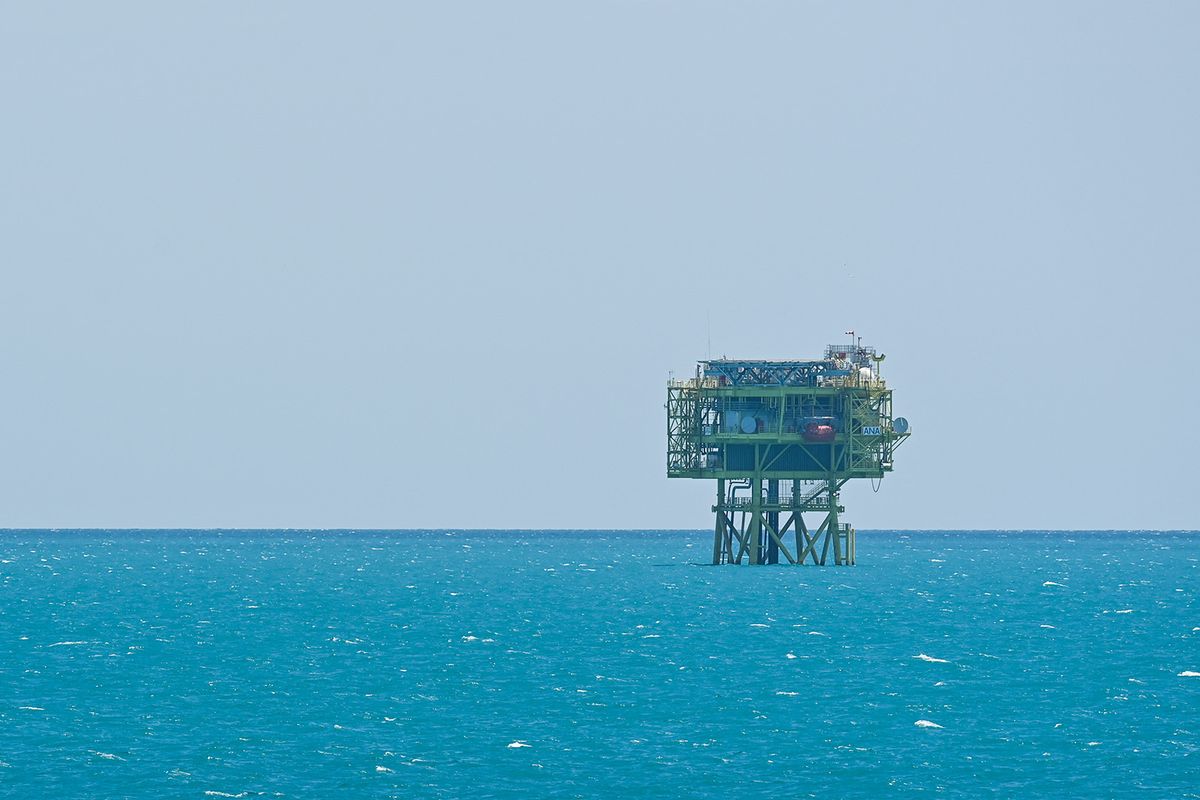 The "Ana" gas production platform, the first offshore platform built and installed in Romania in the past 30 years, is seen from the frigate "King Ferdinand" during the "Shield Protector" military exercise on the Black Sea near Constanta, Romania, on June 21, 2022. Around 800 soldiers take part in the annual "Shield Protector" operation, a two-day drill organized by the Romanian Naval Forces, meant to consolidate the NATO combat procedures among the navy military. (Photo by MIHAI BARBU / AFP)