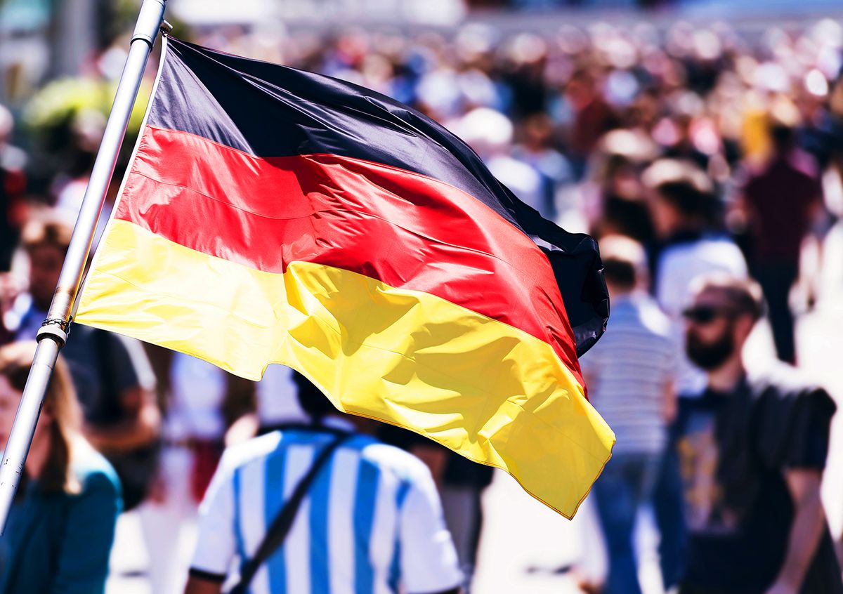 Crowd,Of,People,As,Background,And,Flag,Of,Germany