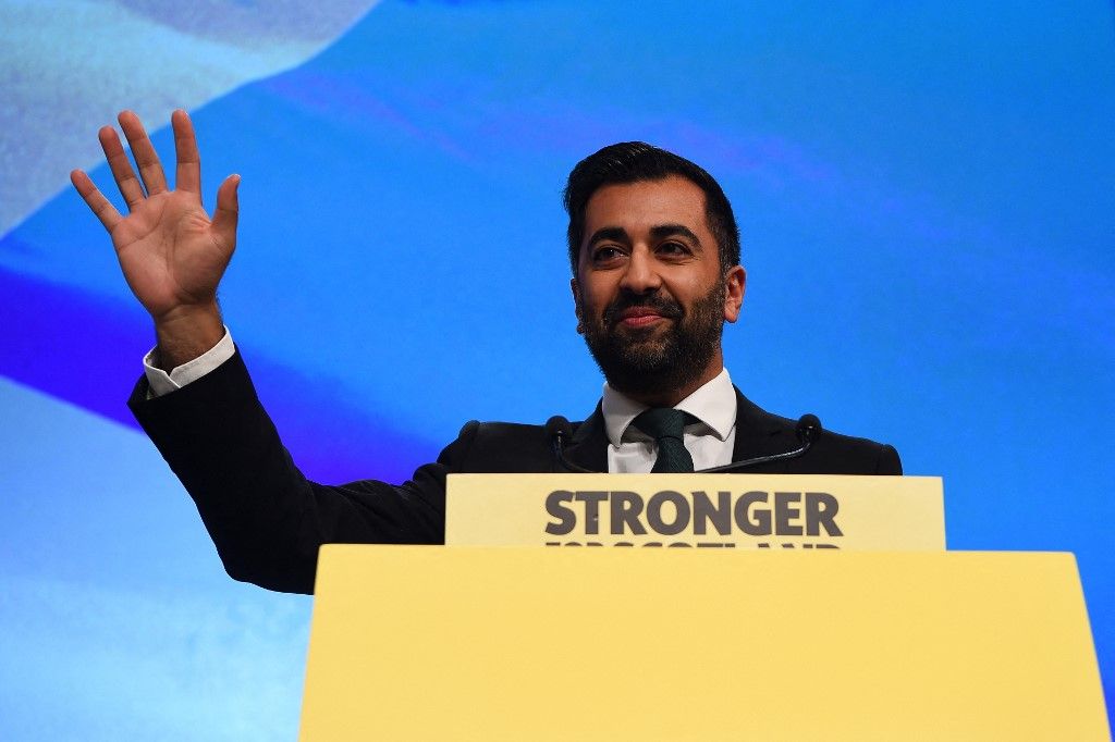 Scotland's First Minister Humza Yousaf waves to the audience as he prepares to deliver a speech during the Scottish National Party (SNP) annual conference, in Aberdeen, on October 17, 2023. (Photo by ANDY BUCHANAN / AFP)