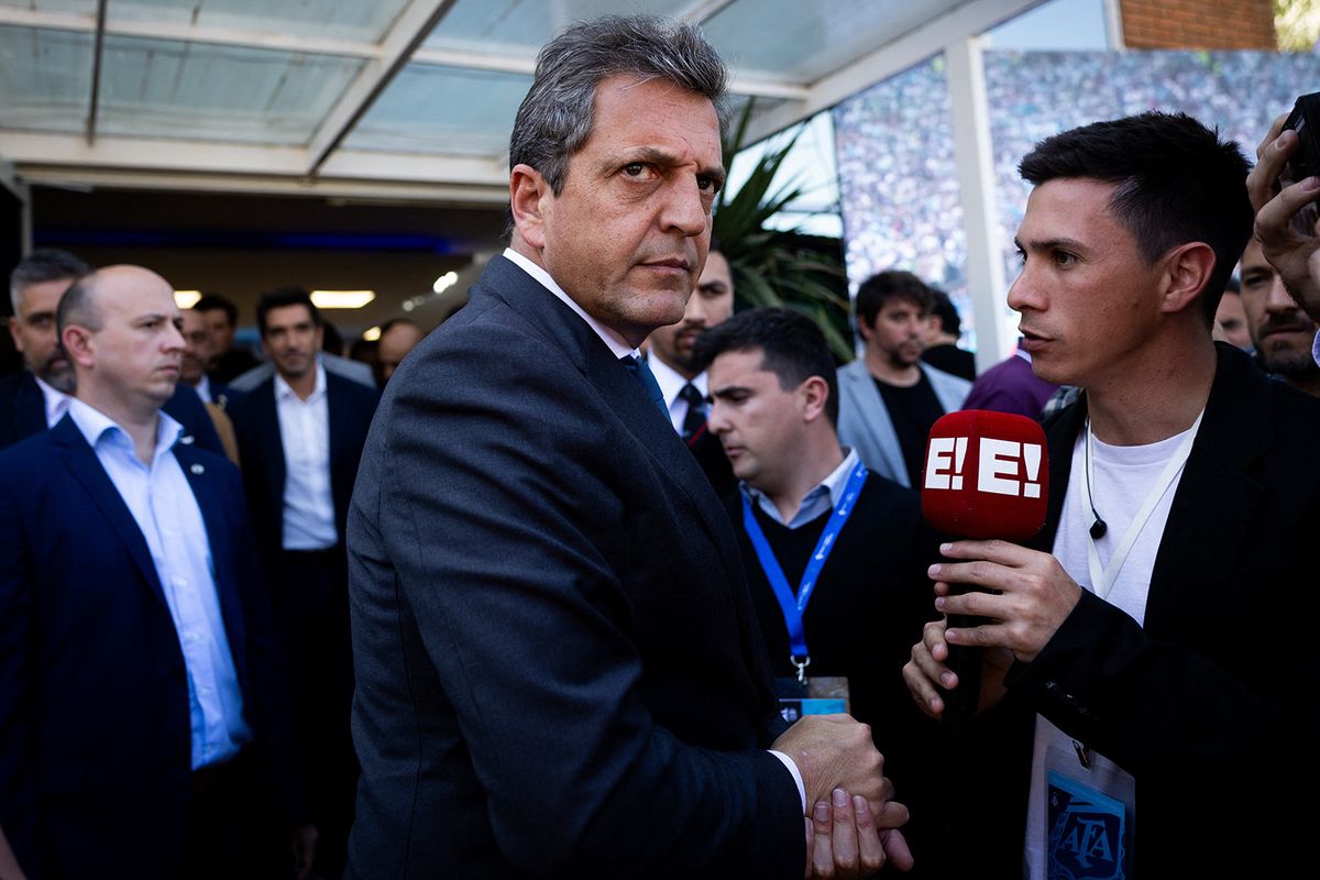 Argentina's Economy minister and presidential candidate Sergio Massa leaves after offering offering a press conference with Sports minister Matias Lammens and the president of the Argentine Football Association (AFA), Claudio Tapia (both out of frame) in Ezeiza, Buenos Aires Province, on October 5, 2023, a day after the announcement that the "inaugural matches" of the 2030 World Cup will be played in Uruguay, Argentina and Paraguay. FIFA, the World football's governing body announced on October 4 that Morocco, Portugal and Spain will jointly host the 2030 World Cup but the opening games will be played in Argentina, Paraguay and Uruguay to celebrate the tournament's centenary. The statement said a "centenary ceremony" will be held "at the stadium where it all began", in Montevideo's Estadio Centenario in 1930. (Photo by Tomas CUESTA / AFP)