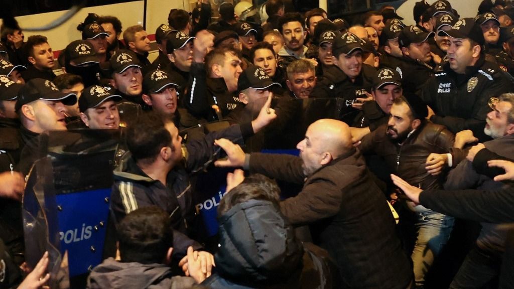 Protesters clash with police officers during a rally in support of the Palestinians, outside the Embassy of Israel, in Ankara on October 18, 2023. Turkish President condemned on October 17, 2023 the deadly Israeli strike on a hospital in Gaza as "the latest example devoid of the most basic human values", in a message on social media. (Photo by Adem ALTAN / AFP)