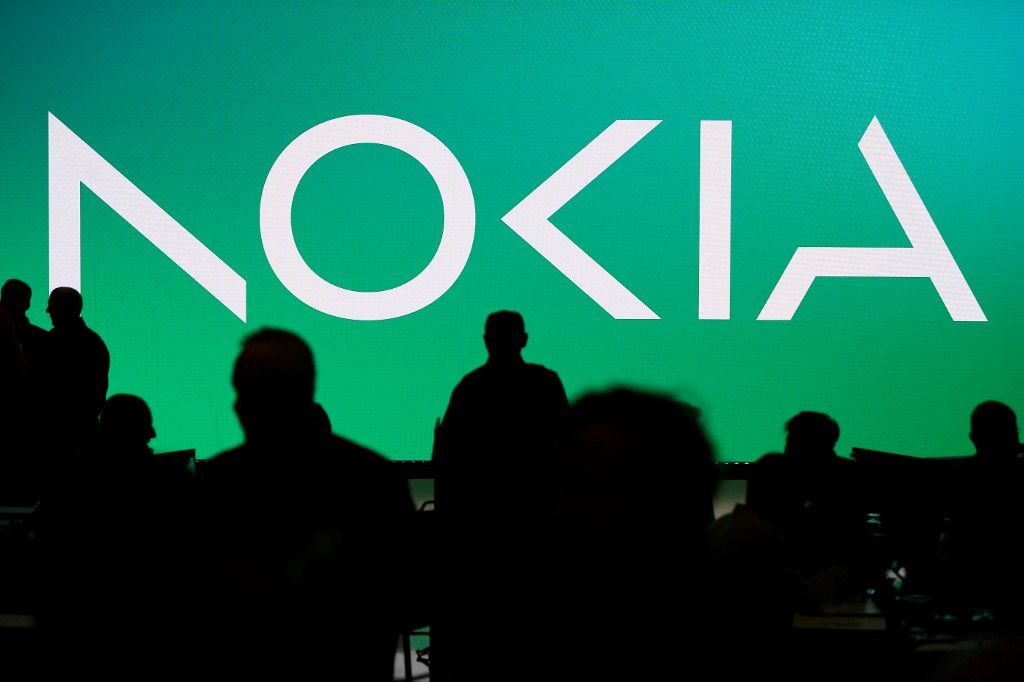 (FILES) A picture taken on February 26, 2023 shows Nokia new logo at the Mobile World Congress (MWC), the telecom industry's biggest annual gathering, in Barcelona. Nokia said on October 19 that it would cut up to 14,000 job as profits fell on weakening demand for its 5G equipment in North America. The announcement adds to a series of layoffs in the tech industry following a boom during Covid pandemic lockdowns. (Photo by Josep LAGO / AFP)