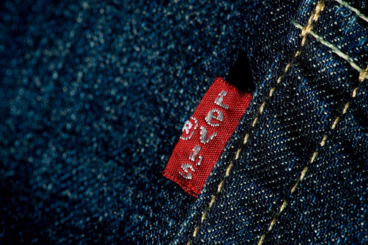 A label reading "Levis" on a pair of Levi Strauss & Co jeans in Munich, Germany, 23 February 2014. Photo: Sven Hoppe (Photo by SVEN HOPPE / DPA / dpa Picture-Alliance via AFP)